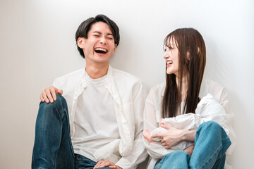 Parents and children holding babies in the living room, family, couple