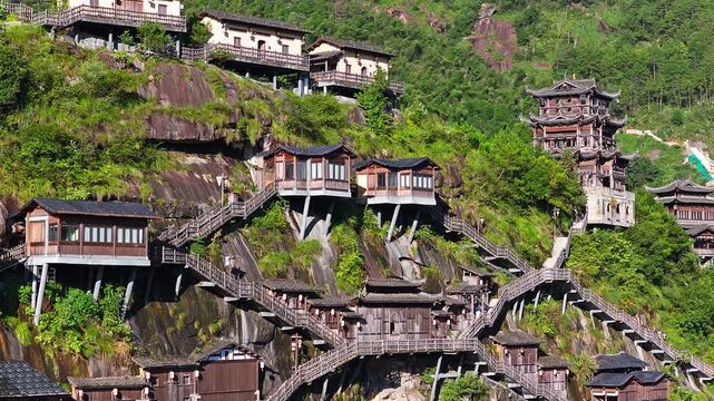 Beautiful ancient villages and traditional wooden buildings are built on the cliffs. The famous Wangxiang Valley Scenic Area is located in Jiangxi, China.