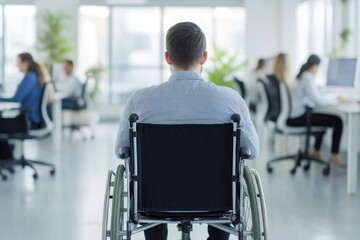 Man in wheelchair in modern office with coworkers disability inclusion and accessibility in workplace back view of person with mobility challenges
