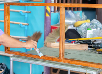 The frame is resting horizontally on a metal-framed workbench with a green surface.