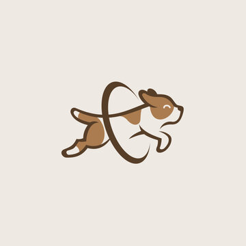 a happy and cute dog jumping through a hoop logo
