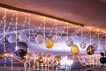 Colorful lighting in a classic space, for parties and celebrations. Colored lights, decorations, flowers, reflections, etc. to illuminate and dance on the dance floor.