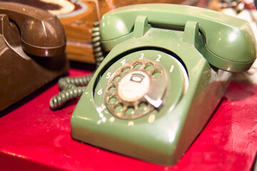 Antique wired transmitter or telephone used to call or communicate with other people, antique, communication, retro vintage, nostalgia, years.