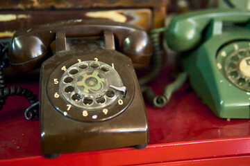 Antique wired transmitter or telephone used to call or communicate with other people, antique, communication, retro vintage, nostalgia, years.