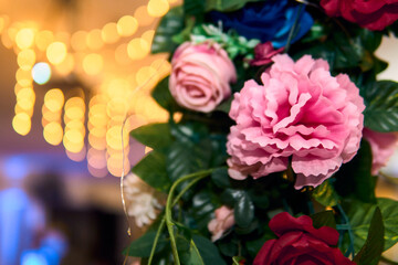 Colorful lighting in a classic space, for parties and celebrations. Colored lights, decorations, flowers, reflections, etc. to illuminate and dance on the dance floor.