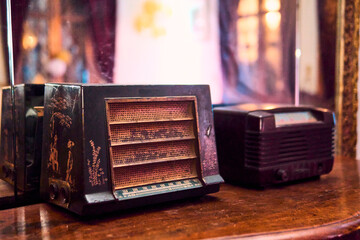 A view of very colorful antique broadcast radios from different eras. Transmitters, colors, styles, vintage, etc. In good condition and working order, reconditioned and recycled. nostalgia