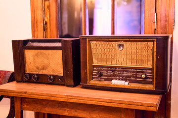 A view of very colorful antique broadcast radios from different eras. Transmitters, colors, styles, vintage, etc. In good condition and working order, reconditioned and recycled. nostalgia