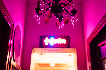 Colorful lighting in a classic space, for parties and celebrations. Colored lights, decorations, flowers, reflections, etc. to illuminate and dance on the dance floor.