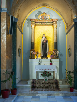 The altar dedicated to Saint Th&eacute;r&egrave;se of Lisieux inside a Catholic church, Santorini, Greece.