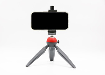 Cell phone on tripod with work path on screen for replacement with picture.