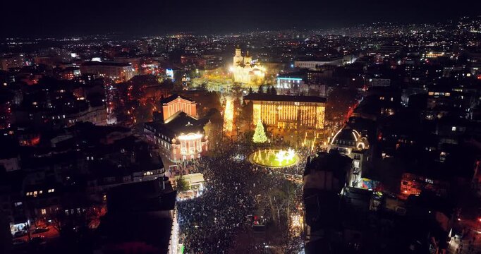 Varna Bulgaria Cityscape Aerial View Night Panorama of Square Celebration With Bright Christmas lights and Large Crowd of People 