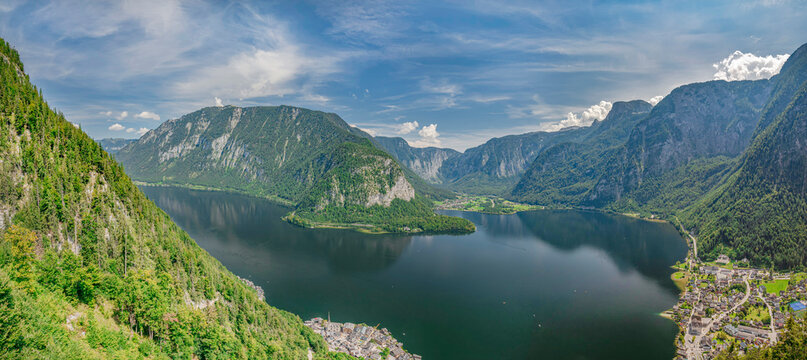 High angle view of Lake Hallstatt and surrounding mountains of Austrian Alps with the town of Hallstatt on the bank and town of Obertraun in distance, Salzkammergut, Hallstatt, Austria, Europe