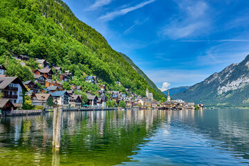 Obraz premium Hallstatt village with reflections located on the banks of the Hallstattersee lake located in the Salzkammergut region of Austria. Hallstatt is a UNESCO World Heritage Site, Hallstatt, Austria, Europe