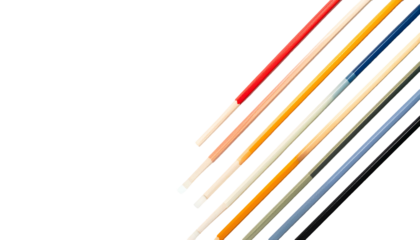Diagonal array of colorful, slender sticks against a stark black background