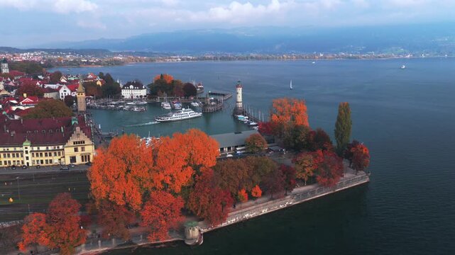 Obersee Bodensee Landau Lake Constance marina harbor view sailboat ferry boat underway Germany Switzerland aerial drone island fall autumn leaves golden hour sunset clouds European upwards motion
