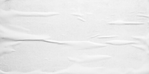 white crumpled and creased glued wrinkled paper poster texture background