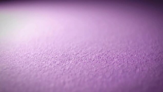 Soft textured purple background with subtle light reflections, perfect for design elements and artistic compositions