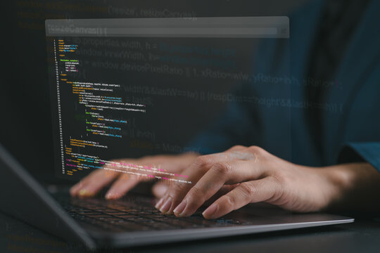 Software development business concept with a programmer coding on a laptop, representing web application development, software engineering, unit testing, and modern programming technology.