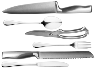 studio photograph of assorted silver kitchen cutlery arranged on a transparent background, including knives, spoons, a pair of shears, and a fork, shiny and metallic