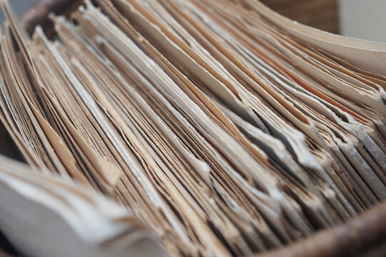 Old files stacked in a storage box for future reference