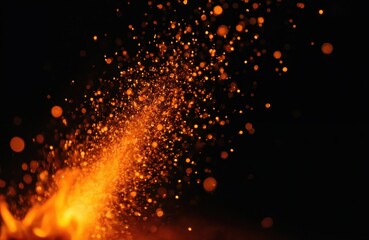 Fiery sparks fly from glowing embers in dark space. Hot orange particles float against black background. Abstract inferno glow texture effect.
