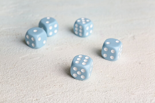 Blue dices on light background