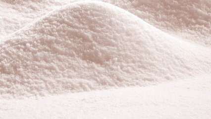 Close-up abstract view of a mound of fine, powdery substance, possibly snow, sand, or a similar material