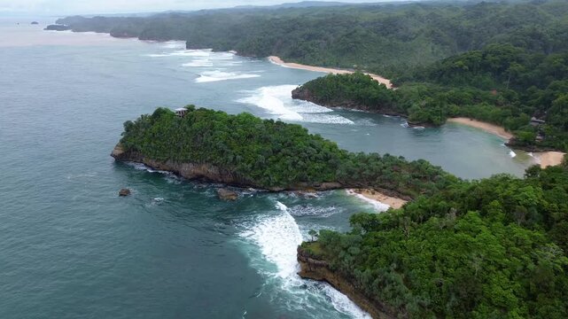 Top Down Drone View of Ocean Waves Crashing on Rocky Coast, Ngliyep Beach Indonesia