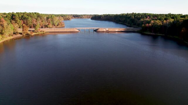 Aerial footage of Lake O' the Pines in Texas flying towards 729 bridge near Hurricane Creek Park.