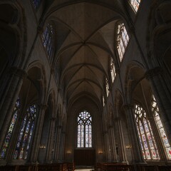Fototapeta premium Vaulted Grandeur: Cathedral Interior with Stained Glass Radiance
