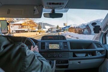 Experience a stunning road trip in Austria s snowy mountains. Navigate through winding roads while...