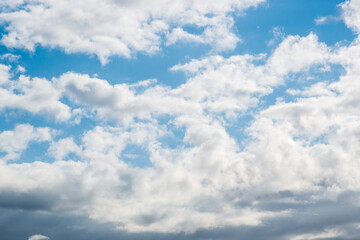 Fototapeta premium Vibrant Blue Sky with Fluffy White Cumulus Clouds Summer Nature Background