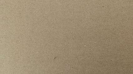 Seamless light brown fiberboard texture background. Close-up of abstract compressed wood material surface and backdrop.