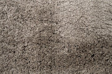 A close-up showcases the soft, plush texture of a carpet, ideal for backgrounds and design projects. Perfect for mockups and adding warmth to creative endeavors. High-resolution image.