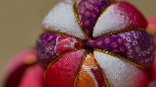 Traditional Japanese Temari Ball Close Up on Tatami Mat Left