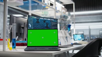 green screen laptop and computer monitor in laboratory showing molecular model soft 