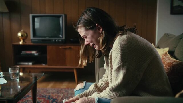 Side view of a woman crying and emotional