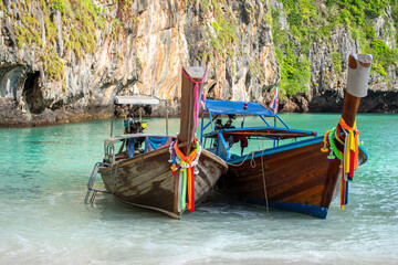 Long boat and blue water at Maya bay in Phi Phi Island, Krabi Thailand.