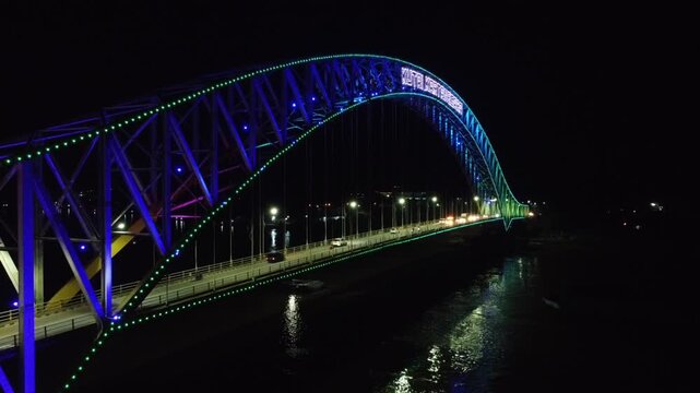 Kutai Kartanegara Bridge, East Kalimantan Indonesia, Night aerial view with car and motorcycle traffic in the middle of the bridge October 27 2021