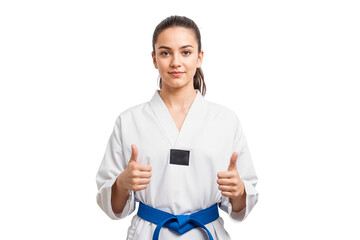 Beautiful taekwondo athlete in uniform with black belt showing thumbs up, isolated on transparent background