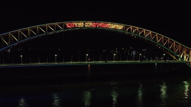Kutai Kartanegara Bridge, East Kalimantan Indonesia, Night aerial view with car and motorcycle traffic in the middle of the bridge October 27 2021