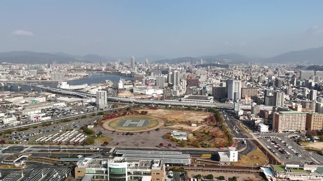 Hiroshima Port, Japan: 4K Aerial Drone Footage of Ferry Terminal, City Skyline, Hiroshima Bay, Harbour Infrastructure, Coastal Mountains and Waterfront Urban Landscape, Ujina Island and Kanawa Island
