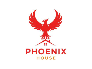 Vibrant phoenix rising from modern house logo design