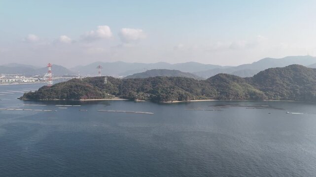 Kanawa Island, Minami Ward, Hiroshima Bay, Japan Coastline: 4K Aerial Drone Footage of Forest Mountains, Rural Island, Autumn Colours, Beaches, Clear Ocean Water, Fish Cage