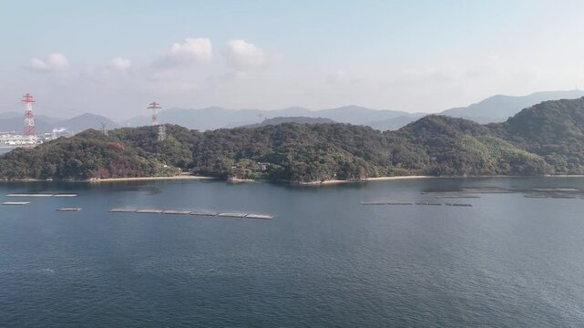 Kanawa Island, Minami Ward, Hiroshima Bay, Japan Coastline: 4K Aerial Drone Footage of Forest Mountains, Rural Island, Autumn Colours, Beaches, Clear Ocean Water, Fish Cage