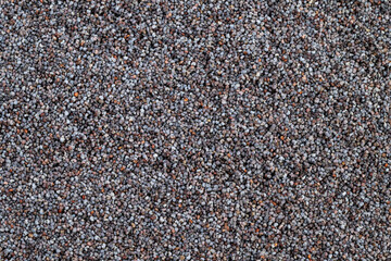 Close up poppy seeds texture showcasing tiny glossy seeds, minimalist culinary mood, pastry chef ingredient, neutral lighting, high detail for backgrounds and food packaging