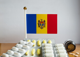 Flag of Moldova with Pills and Capsules. Pharmaceutical Concept
