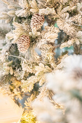 Blue Christmas tree with snowflakes falling on its branches