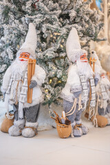 Blue Christmas tree with snowflakes falling on its branches