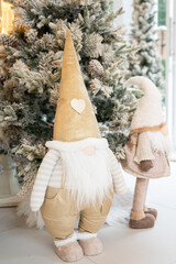Blue Christmas tree with snowflakes falling on its branches